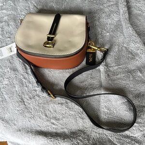 Coach color, black saddle, bag new with tag